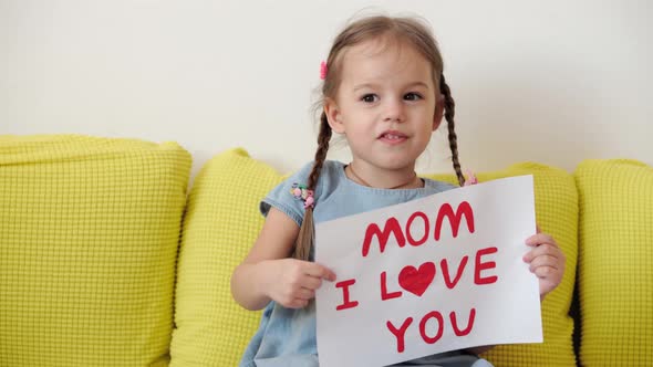 Close Up Cute Little Preschool Caucasian Girl 34 Years Holding White Sheet with Declaration of Love alt