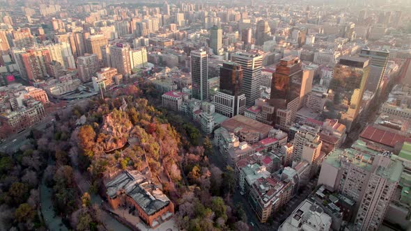 Aerial dolly in of Hidalgo Castle located at the top of Santa Lucía Hill, autumnal tree tops, Santia alt