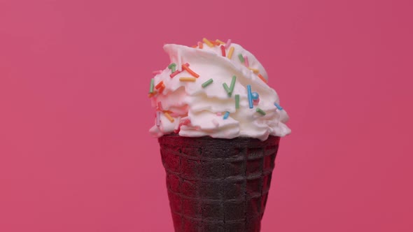 Soft Ice Cream in Black Cone Decorated with Sprinkles 