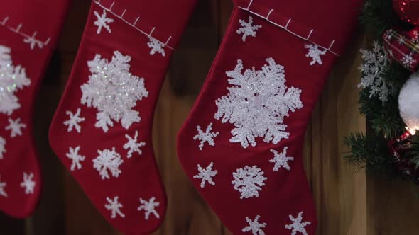 Panning across christmas stockings on mantle alt