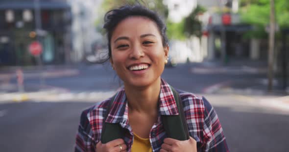 Mixed race woman smiling at the camera alt