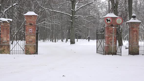 Open Red Brick Park Gate in Winter