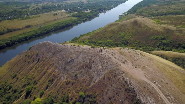 Riders on a Rocky Hill in the Countryside alt