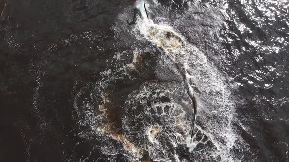 Water Sports  a Man Flying Around Over the Water on the Flyboard in Circles  Aerial View alt