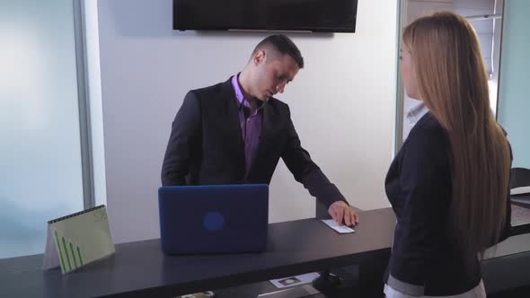 Female Cash Check at Service Desk alt