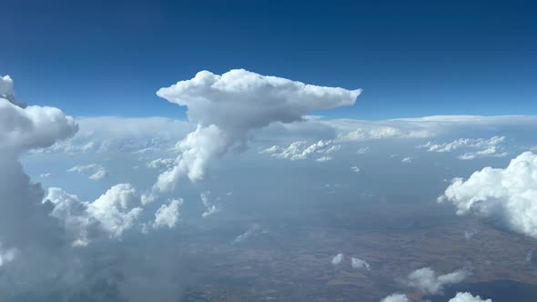 Awesome cockpit view. Pilot POV avoiding cumulus during the descend in a hazy atmosphere and a deep alt