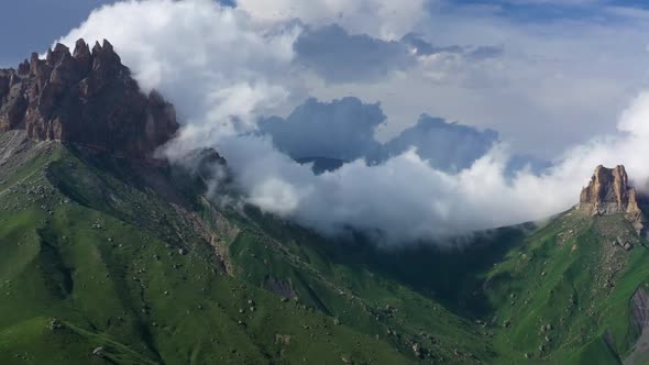 Caucasus Mountains Under Moving Clouds alt