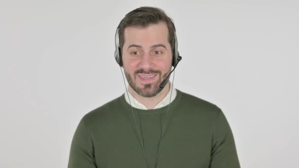 Portrait of Man with Head Set Talking White Screen alt