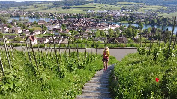 Woman Running in the Swiss Vineyards alt