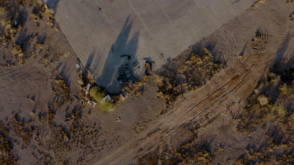 Abandoned Propellor Plane in Desert Field Aerial alt