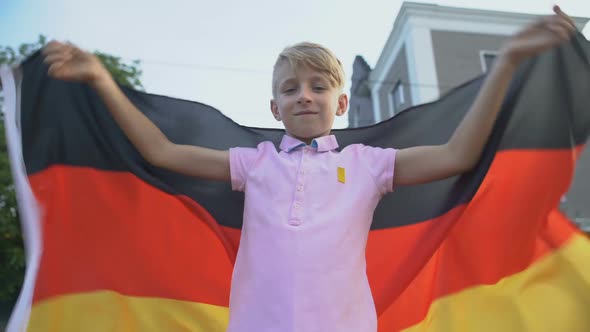 Patriot Young Boy Waving German Flag, Celebrating National Independence Day