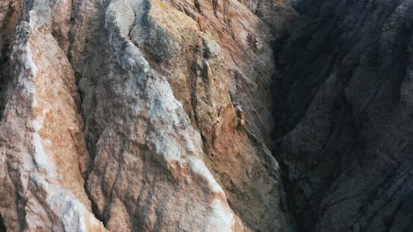 Aerial View of a Landscape Similar To the Planet Mars with Red Hills and Rivers with Red Water alt