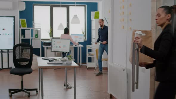Businesswoman Holding Takeaway Food Order Paper Bag During Takeout Lunchtime alt