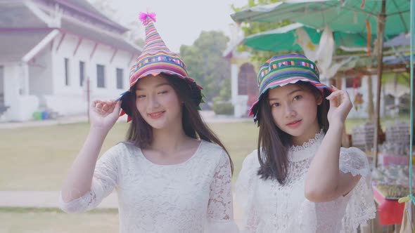 Two Girls Having Fun With Hat alt