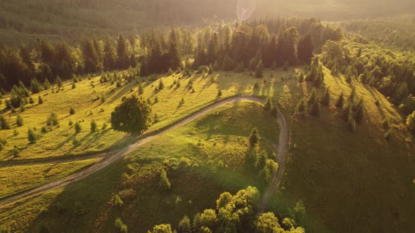 Aerial view of beautiful mountain Carpathians, Ukraine in sunlight. Drone filmed an landscape 