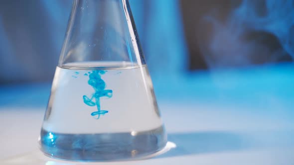Chemical Test in Laboratory, Scientist Performing Chemical Liquid Test in Laboratory alt