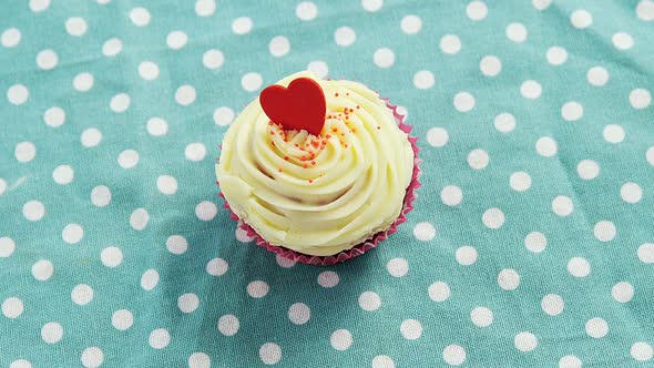 Cupcake against polka dot background alt