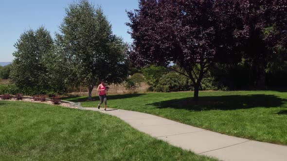 Athletic woman running at park