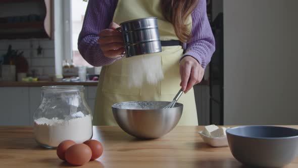 Woman Is Adding Flour to Dough