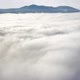 Aerial Flight Beyond Sky Over Morning Fluffy Clouds High in the Mountains - VideoHive Item for Sale