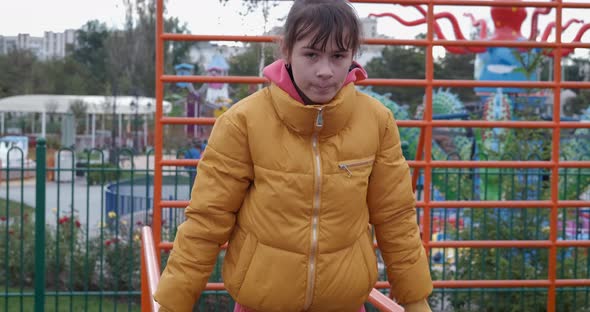 Girl on uneven bars. alt