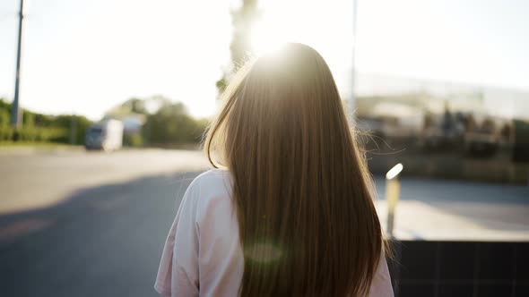 Portrait of Gentle Female Person Looking at Camera and Spin alt
