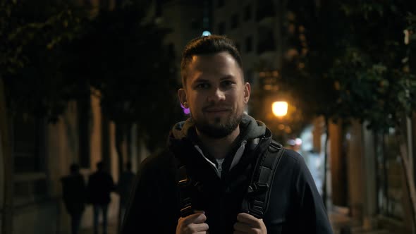 Portrait of a Successful Young Tourist Man Student Officer Manager After Work a Public Place Looks alt