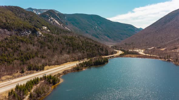 Franconia notch interstate 93 unique mountain pass road with alpine lake Drone Aerial time lapse hyp alt