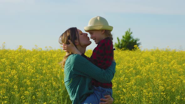 Farmer Family Funny a Mother Holds Daughter in Her Arms Little Girl alt