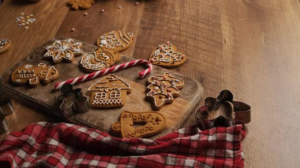 Decorated Gingerbread Figures on Wooden Board alt