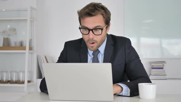 Shocked Businessman Wondering in Awe at Work alt