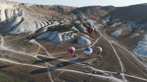 the Beginning of the Flight of Colored Balloons Top View. Drone Shooting