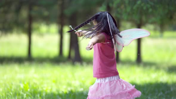 Girl in fairy princess costume spins holding dandelions, shot on Phantom Flex 4K alt
