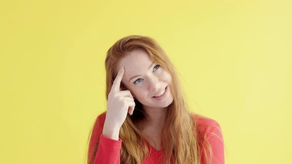 Beautiful Caucasian serious female is happy that has found solution to problem
