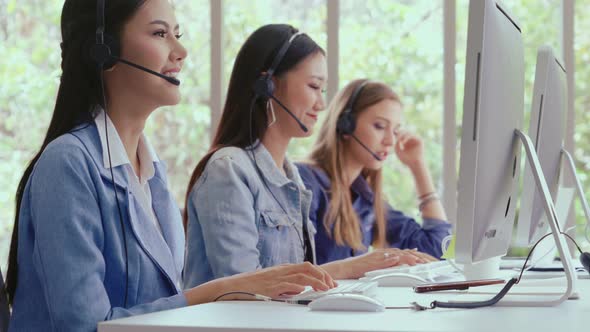 Customer Support Agent or Call Center with Headset Talking to Customer on Phone alt