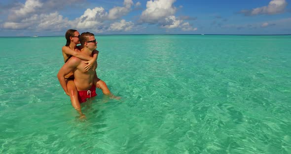 Happy boy and girl married on vacation enjoy luxury on beach on summer white sandy  alt