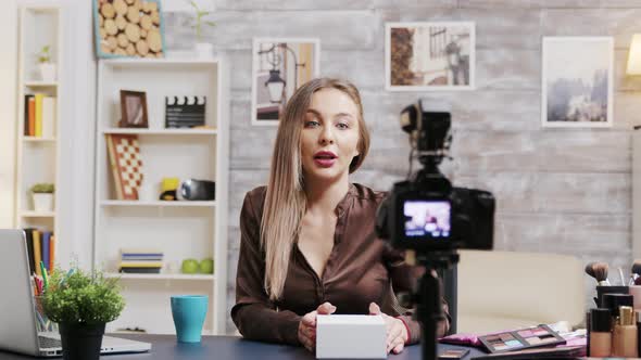 Beauty Influencer Recording a Vlog About Cosmetics alt
