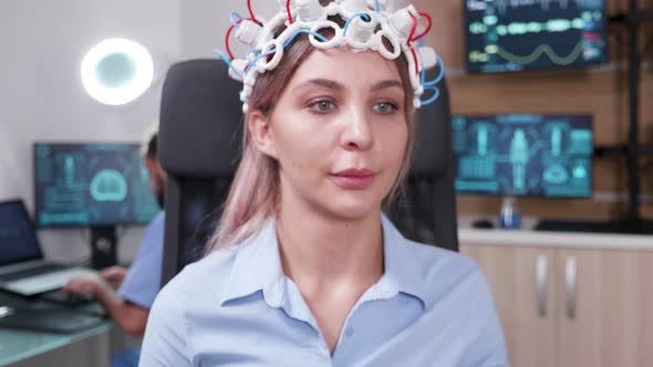 Female Patient Wearing Brainwave Scanning Headset alt