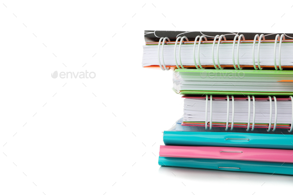 Pile of copybooks isolated on white background