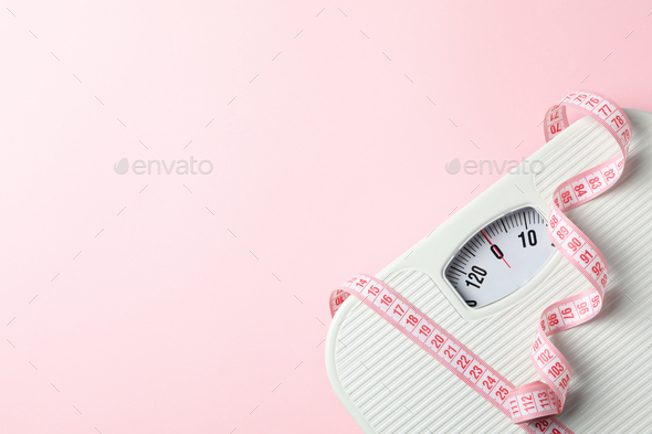 Pink Measuring Tape On The White Background Stock Photo, Picture