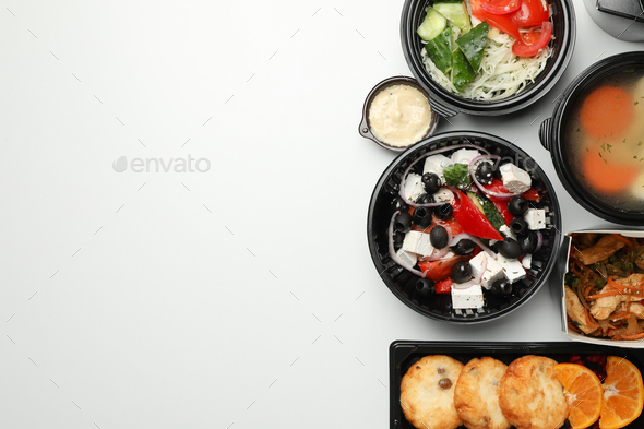 Food delivery. Food in take away boxes on white background