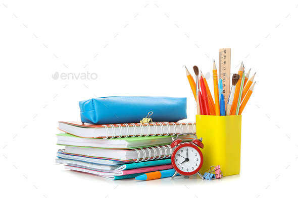 Pile of copybooks and stationery isolated on white background