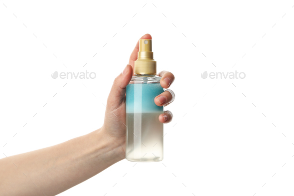Female hand holds cosmetic spray, isolated on white background