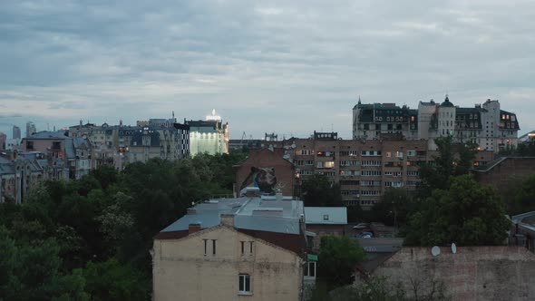 Huge Mural Street Art Graffiti  On The Buildings Wall While Rising Above The City With A Drone