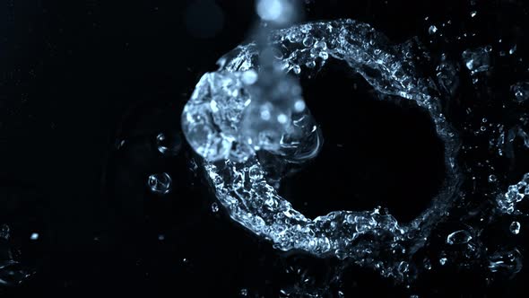 Super Slow Motion Shot of Splashing Water on Black Background at 1000Fps alt