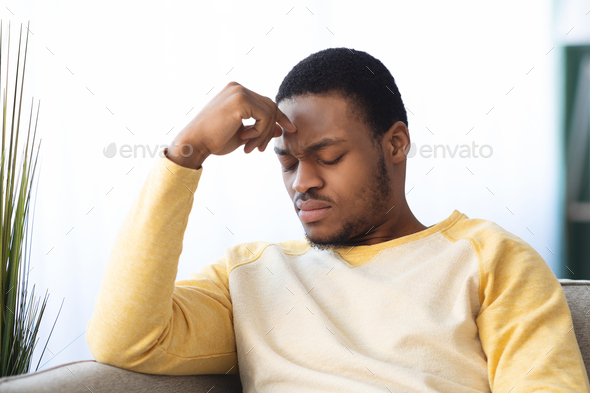 Upset black guy suffering from headache, closeup Stock Photo by ...