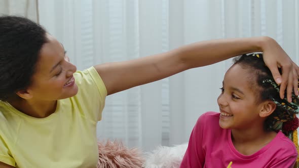 Mom and Daughter are Happily Hugging and Smile alt