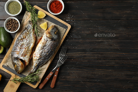 Dorado fish on cutting board.  Food Images ~ Creative Market