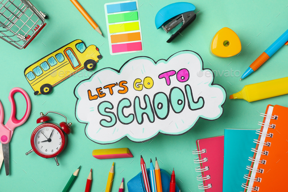 Text Let\'s go to school and school supplies on mint background