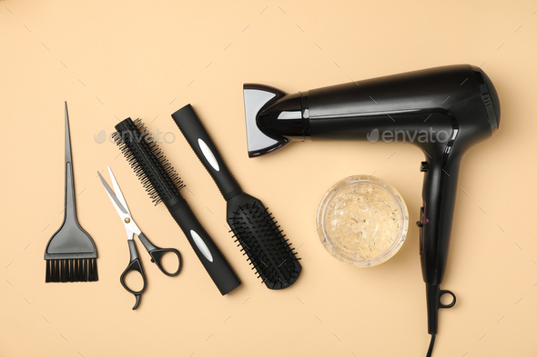 Black hairdresser scissors on wooden background, close up Stock Photo by  AtlasComposer